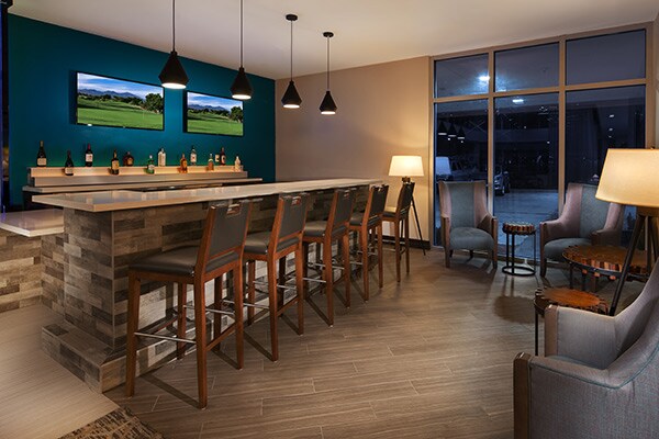 Image rending of Executive Residency bar with sitting area
