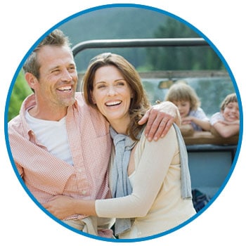 Man and Woman with young family enjoying a vacation