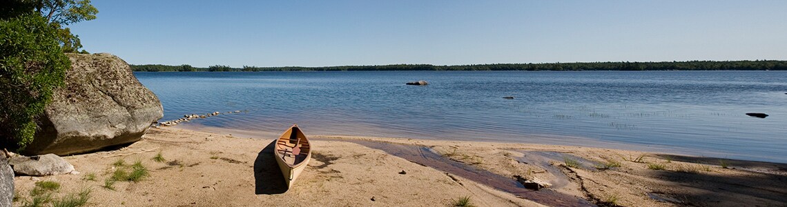 Canoes on lake in Kejimkujik National Park 