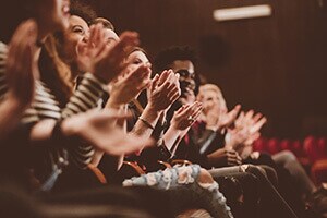 People clapping in a Ohio theater