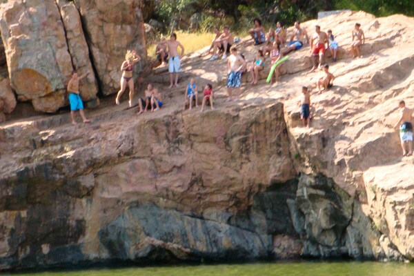 People on a rock at Devil's Waterhole
