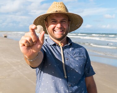 Chet shelling on the beach.