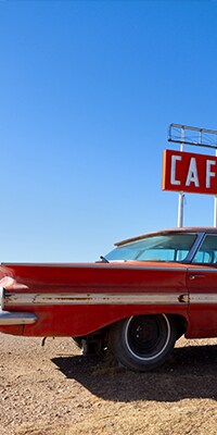 Old car and cafe sign