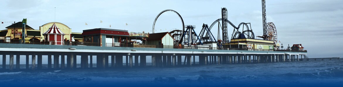 Beach boardwalk with carnival and buildings