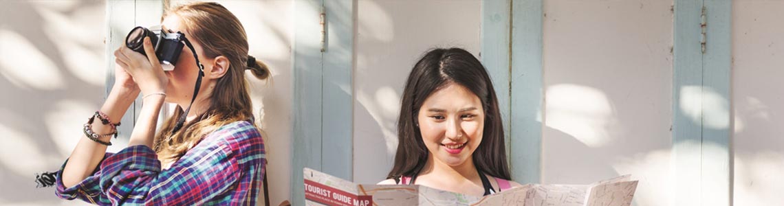 Young women using their Best Western Rewards while traveling.