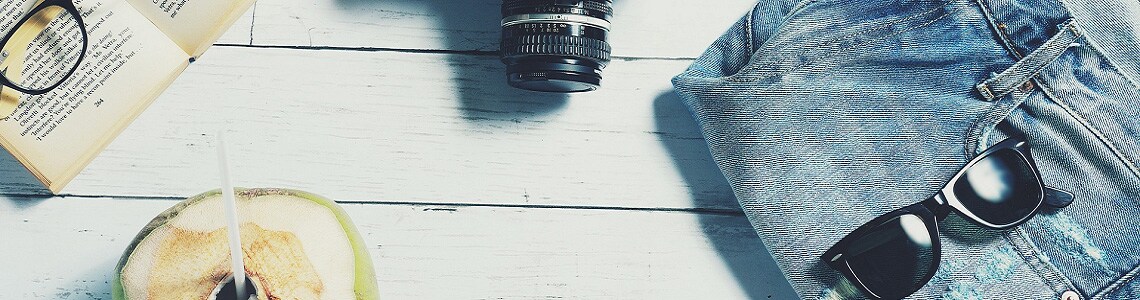 Items to bring when you travel include a camera, book, glasses, blue jeans,  sunglasses, fruity drink.