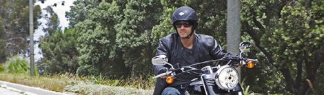 man riding a harley davidson motorcycle
