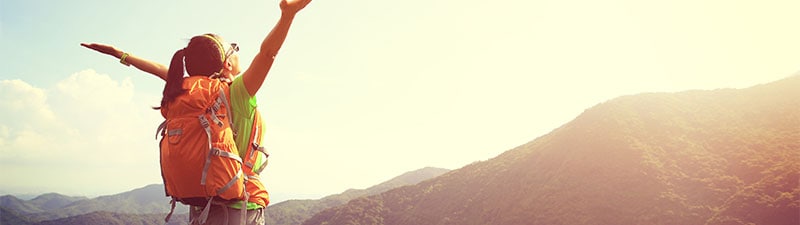 hiker at top of mountain