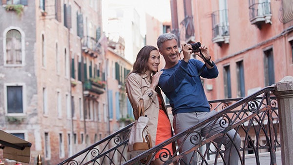 Couple on steps taking a photo