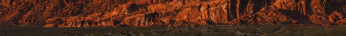 view of red canyons in the sunset