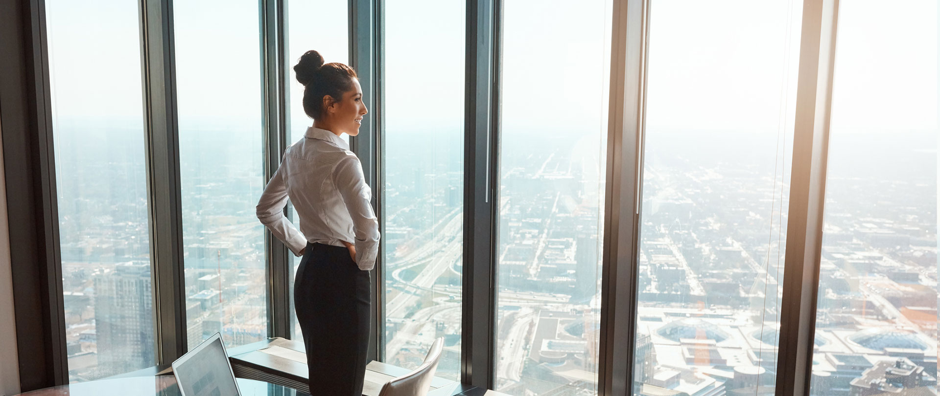 Business woman looking out a window