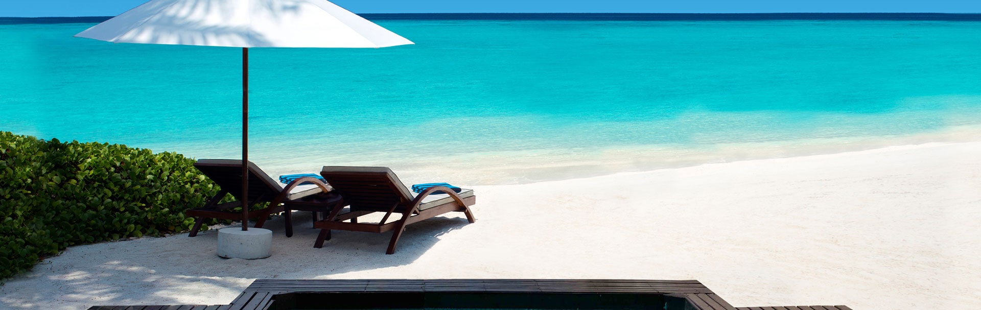 Image chair on the beach with an umbrella