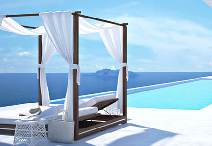 Pool overlooking the ocean with a cabana