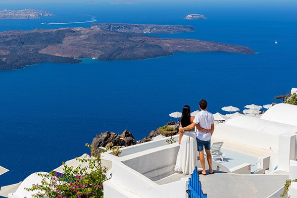 Couple on a deck enjoying thier WorldHotels Rewards