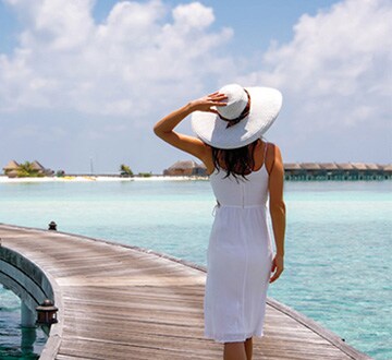 woman walking on pier
